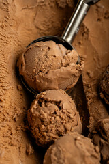 Close-up of chocolate ice cream scoops with rich texture and creamy surface