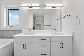 Bathroom with a white sink and a white bathtub