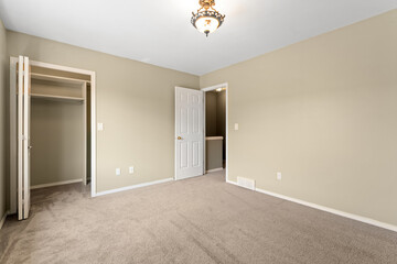 Bedroom with a white wall and a white door