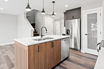 Kitchen with a stainless steel sink and a silver dishwasher