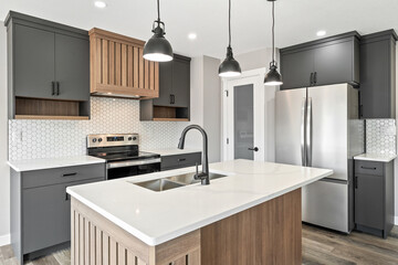 Kitchen with a white countertop and a stainless steel sink