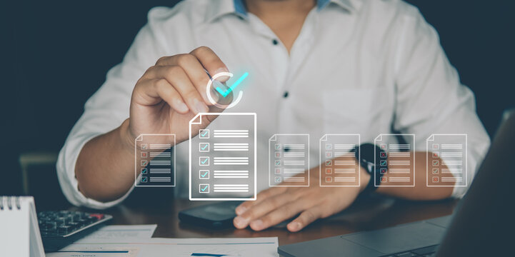 A man in business attire interacts with a digital touchscreen, organizing files and folders using futuristic data interface graphics.