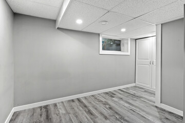 White room with a window and a door