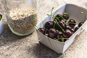 Cherries in carton with oats jar