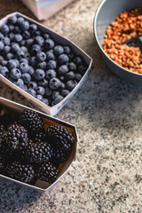 close up of Blackberries and blueberries with granola bowl