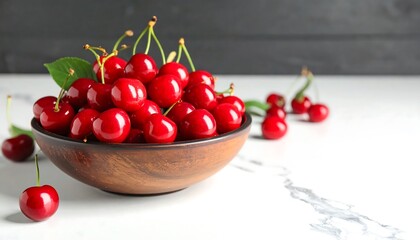 Fresh cherries in a wooden bowl on a marble surface (1)
