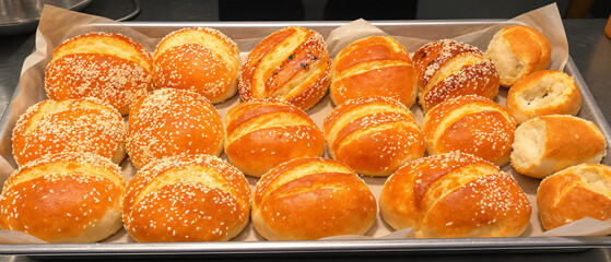 Variety of Bread Rolls Arranged on Tray