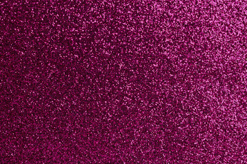 A close up of a purple glittery surface