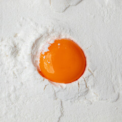 Egg made of white powder and yolk. Flat lay. Creative copy space concept.