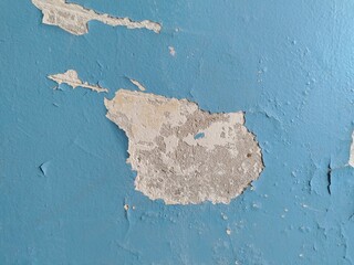 Old cracked blue paint on room wall. Cleaning. Peeling off painted background. House repair. Housing service. Plaster. repaint. Poverty concept. conservation. Textured wallpaper