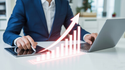 Businessman analyzing companys financial statistics data and charts on computer and tablet, business growth and investment concept
