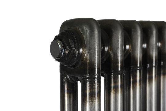 Modern loft style steel radiator section close up isolated on white background. Industrial metallic heating battery component with weld marks