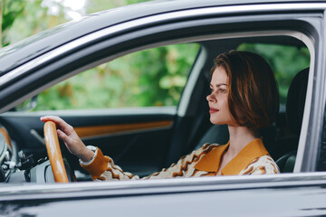 Naklejka premium Portrait of a woman driving a car, focused and calm, bathed in warm natural light with a vintage interior and stylish mood.