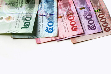 Banknotes with coins of the Thai baht money