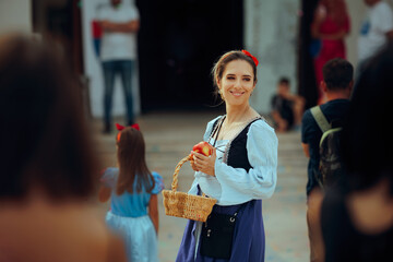 Smiling Woman in Historical Gown at a Public Carnival Event. Cheerful lady dressed as a noble woman attending a festival 
