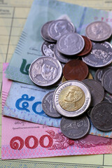 Banknotes with coins of the Thai baht money