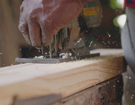 Close-up of a carpenter using a jigsaw