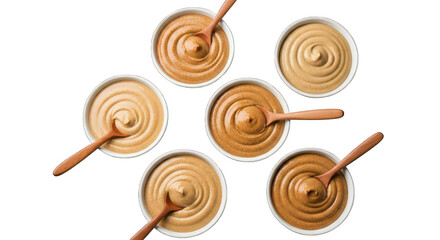 Seven bowls of tan creamy dips with wooden spoons on a black background