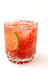 A vibrant red strawberry cocktail or mocktail with crushed ice and a lime wedge garnish, served in a classic glass on a clean white background, perfect for party promotions, and beverage advertisement