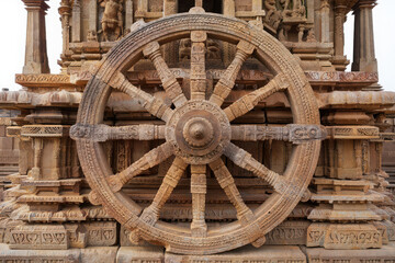 Ancient stone chariot wheel at a historic indian temple