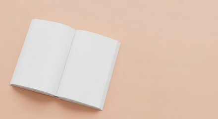 Naklejka premium Open book with blank white pages resting on a beige or light brown background
