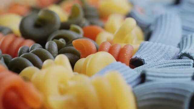 Pasta mix, different Italian tagliatelle fussili pasta packaging window, Fettuccine pasta, close up, not cooked