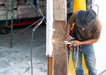 The scene takes place on a construction site, with tools and scaffolding.
