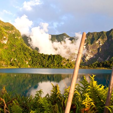 Mountain lake with misty clouds