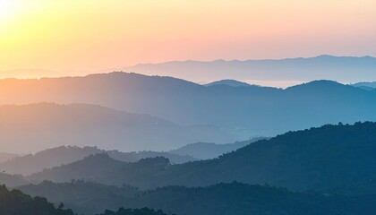 Obraz premium Warm Sunrise Gradient Over Distant Hills Dreamy Atmosphere