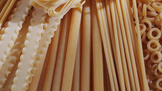 Pasta mix, different Italian tagliatelle fussili pasta packaging window, Fettuccine pasta, close up, not cooked