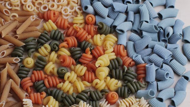 Pasta mix, different Italian tagliatelle fussili pasta packaging window, Fettuccine pasta, close up, not cooked