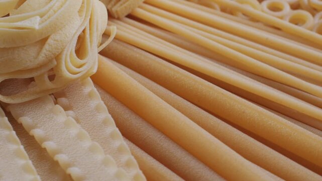 Pasta mix, different Italian tagliatelle fussili pasta packaging window, Fettuccine pasta, close up, not cooked