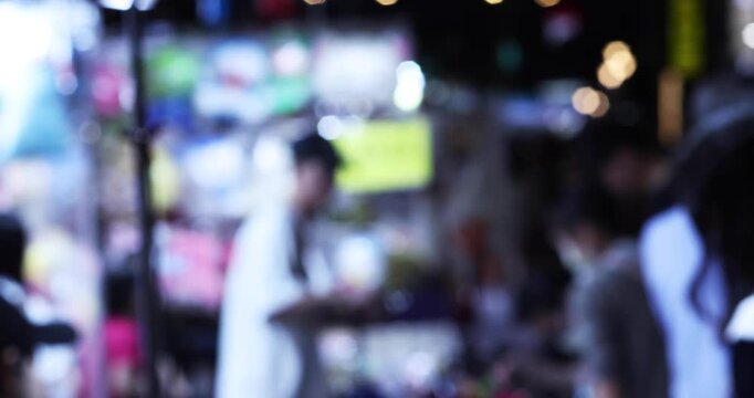 Defocused walking people at Ningxia night market in Taipei handheld