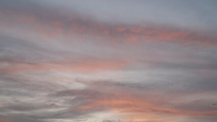 colorful burnt clouds glowing in shades of orange and red in the sky