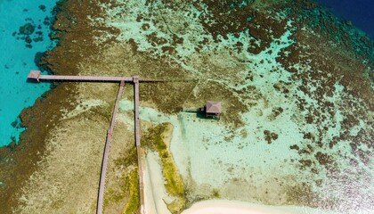 Aerial View of a Coral Reef Mosaic with a Jetty