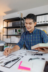 Young architect working in office with building models and floor plans, analyzing details and creating innovative design concepts, showing creativity, focus, and dedication in architecture projects.