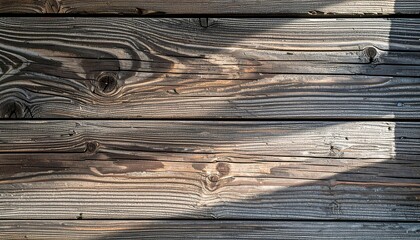 Weathered wooden planks with sun shadows