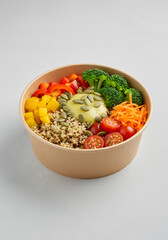 Colorful Quinoa Bowl with Vegetables and Creamy Dressing Closeup