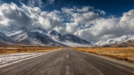 Embark on an unforgettable road trip adventure through stunning mountain scenery with snow-capped peaks and endless blue skies