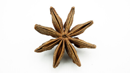 Star anise in closeup on white background