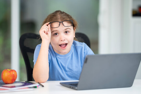 Home study for child. Kid studying on laptop e-learning. Teen student study lesson on laptop. Child study schoolwork in home classroom interior. Online study. Education and studying online.