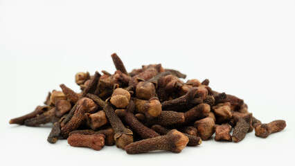 Cengkeh or cloves are aromatic dried flower buds. Dried cloves isolated on white background with clipping path. Flat lay or top view.