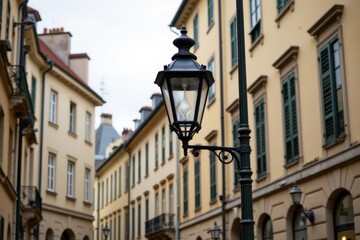 Elegant vintage street lamp illuminating historic European city street with classical architecture and colorful facades du daytime