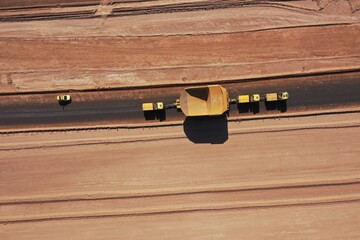 Heavy transport convoy moving a mining haul truck through desert highways in Chile