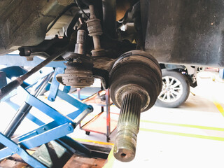 Ball joint and suspension of vehicle are broken, Maintenance car concept.