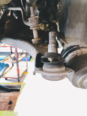 Ball joint and suspension of vehicle are broken, Maintenance car concept.