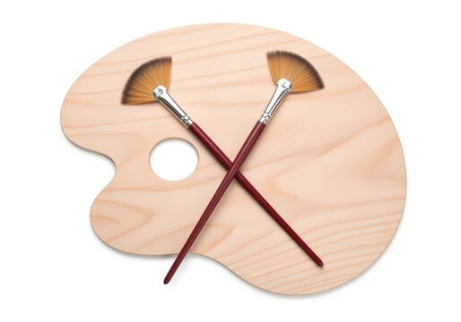 Wooden art palette with fan brushes crossed