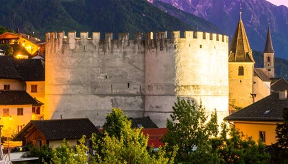 Medieval fortress at twilight in alpine town