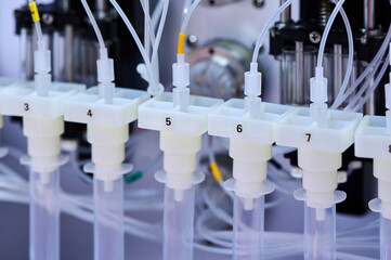 Modern medical equipment dispensing chemicals in laboratory setting