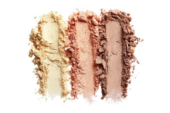 Three swaths of loose powder, light beige, peach, and brown,  crumble  against a dark background.  Each shade is distinct,  with varying textures and shades